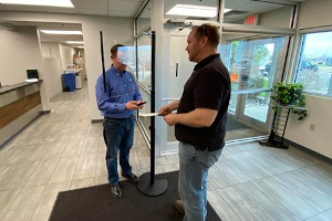 floor stand acrylic face shield in office entrance